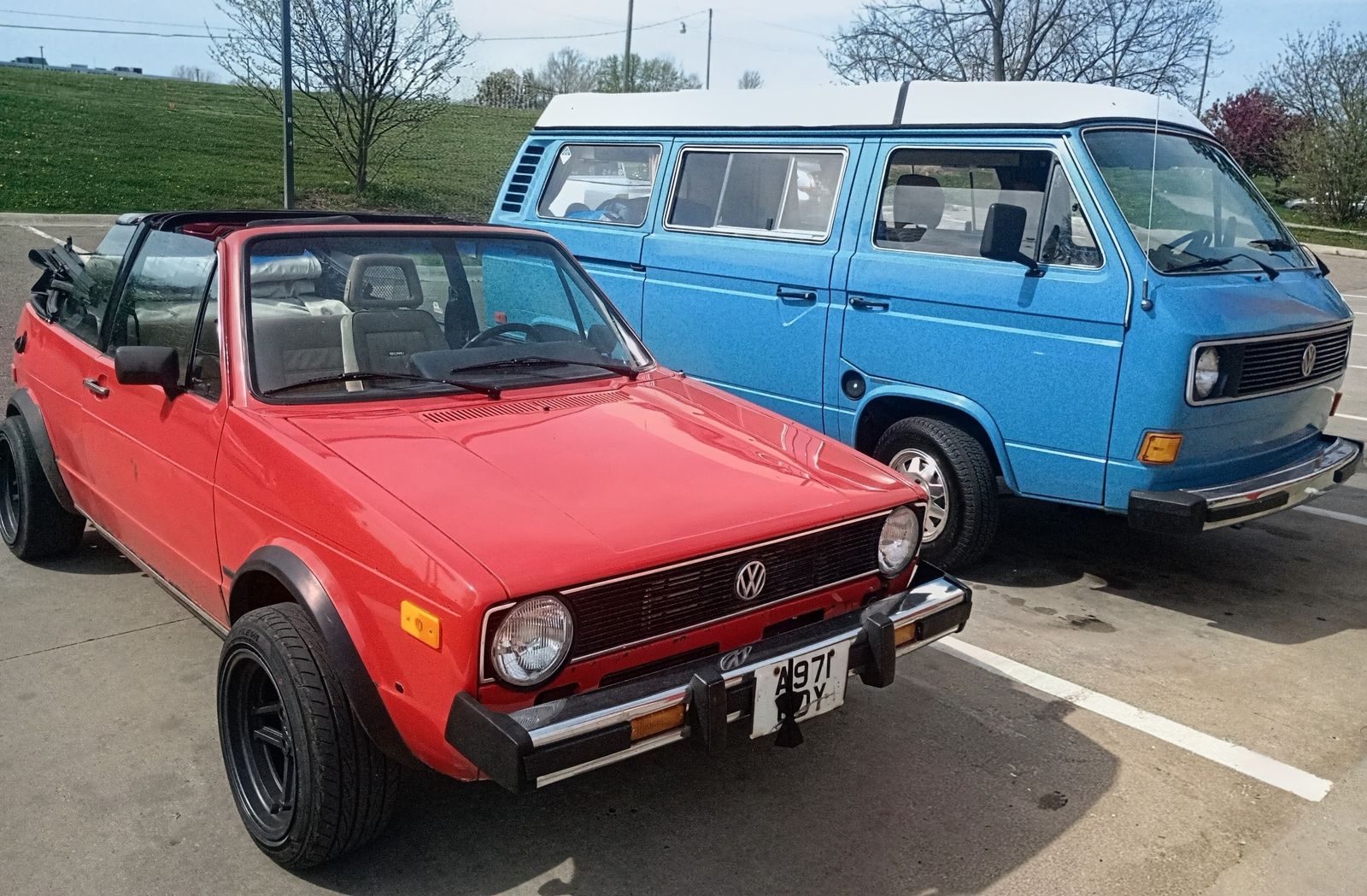 Roger — 1984 VW Rabbit Cabriolet 1.8T swap, parked next to a blue VW T3 bus